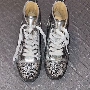 Preloved Christain Louboutin size 71/2 sneakers never been worn .excellent cond.